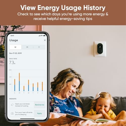 Woman and child on couch viewing energy usage on smartphone app.