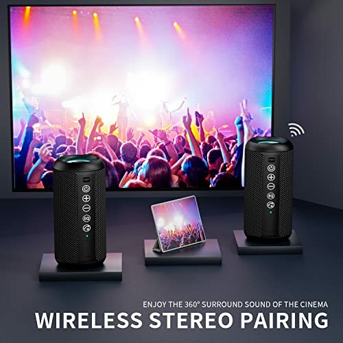 Wireless stereo speakers with a concert scene on screen.